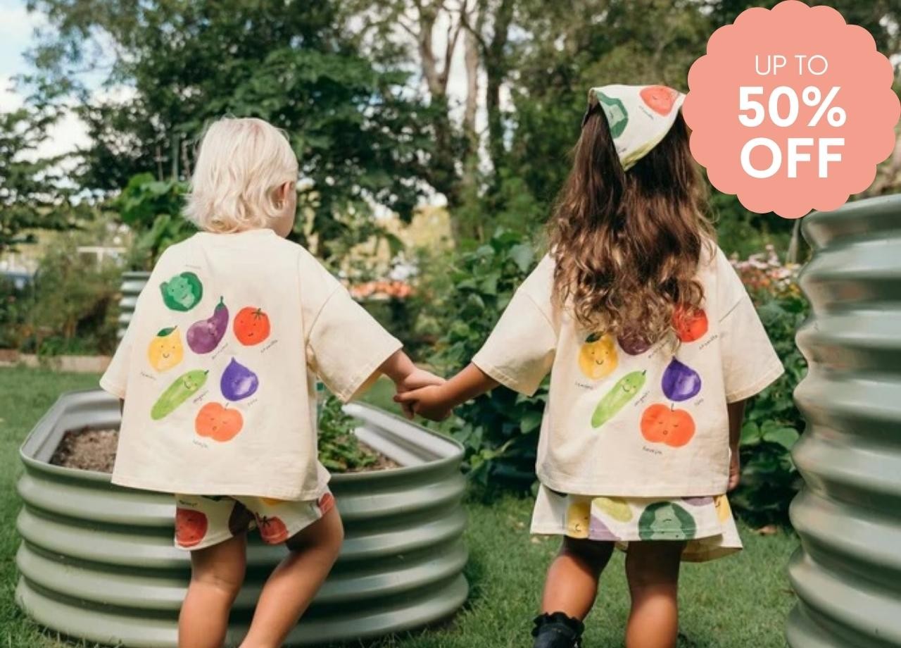 two children in t shirts with fruit print on them