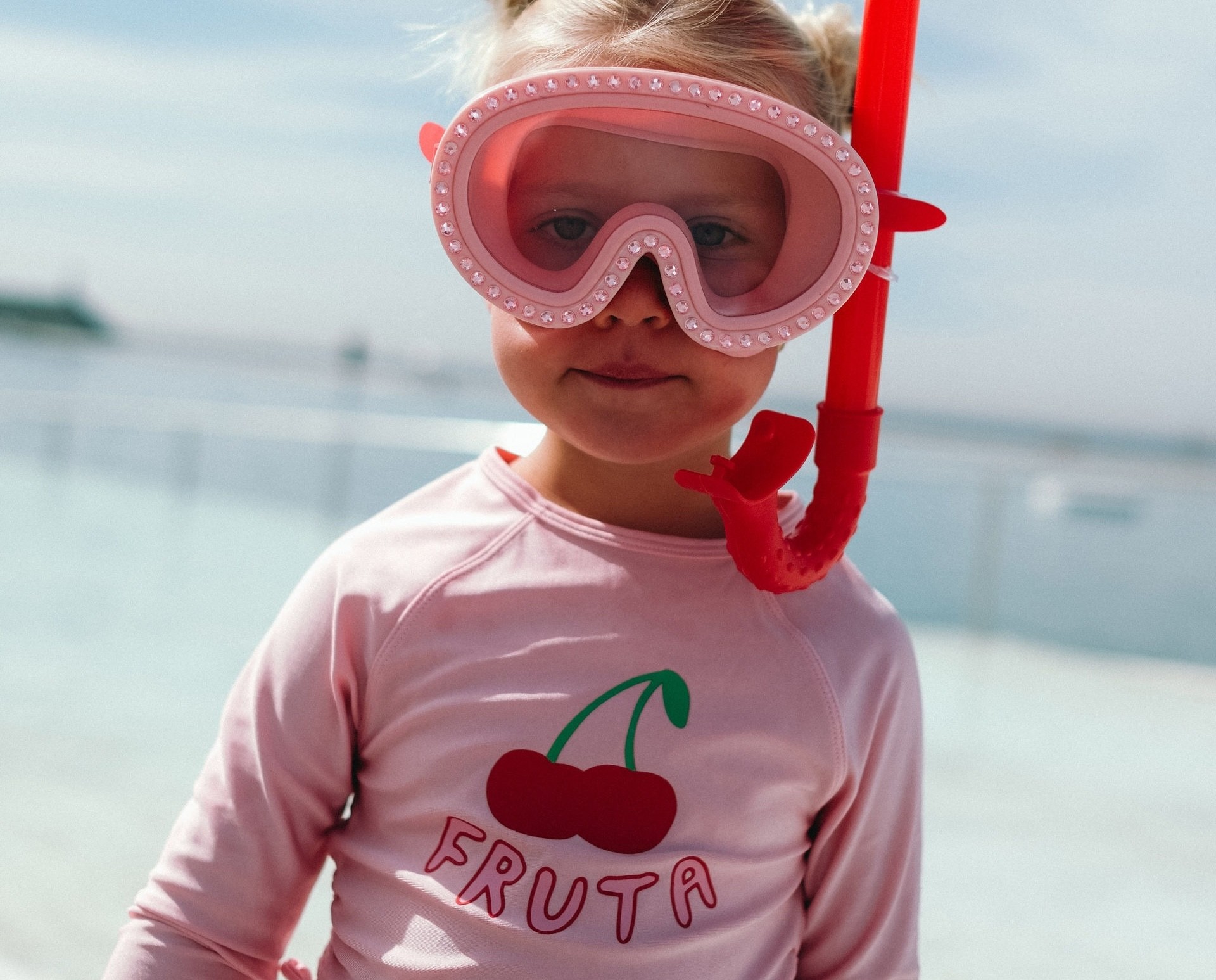 A toddler in kids swimwear brand cotton on