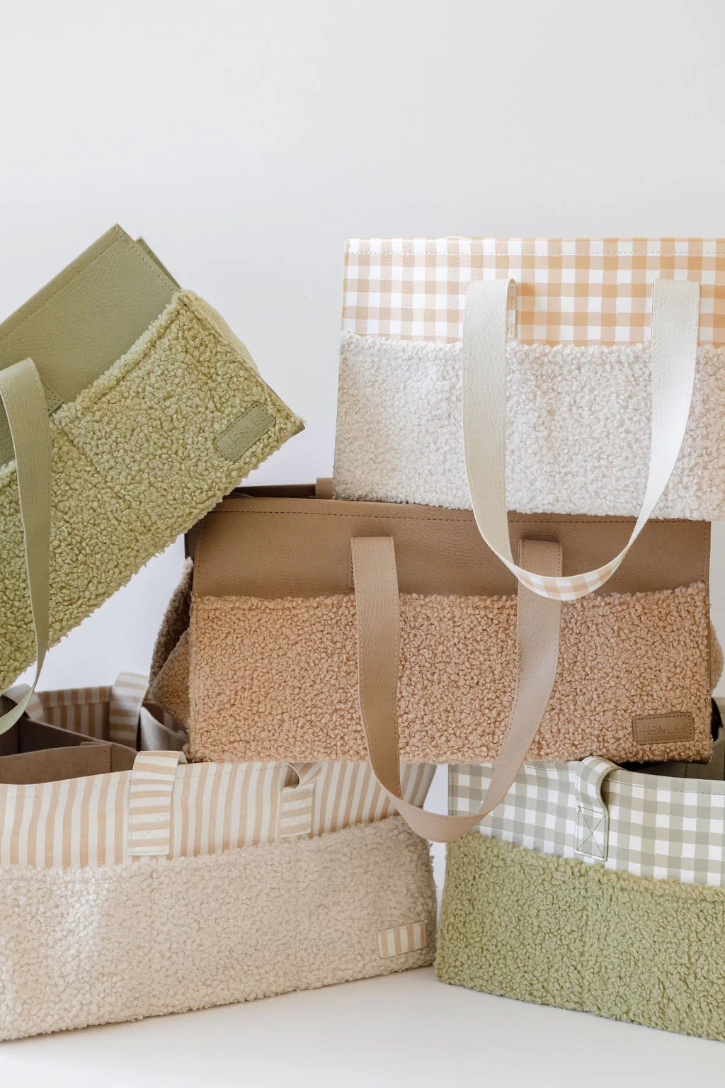 Henlee nappy caddy organisers shown in all colours including brown and cream with gingham print