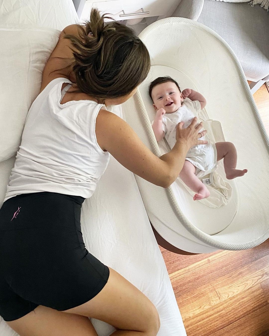 Pregnant mum wearing maternity leggings playing with her baby, highlighting bonding moments while managing bump related issues during pregnancy.