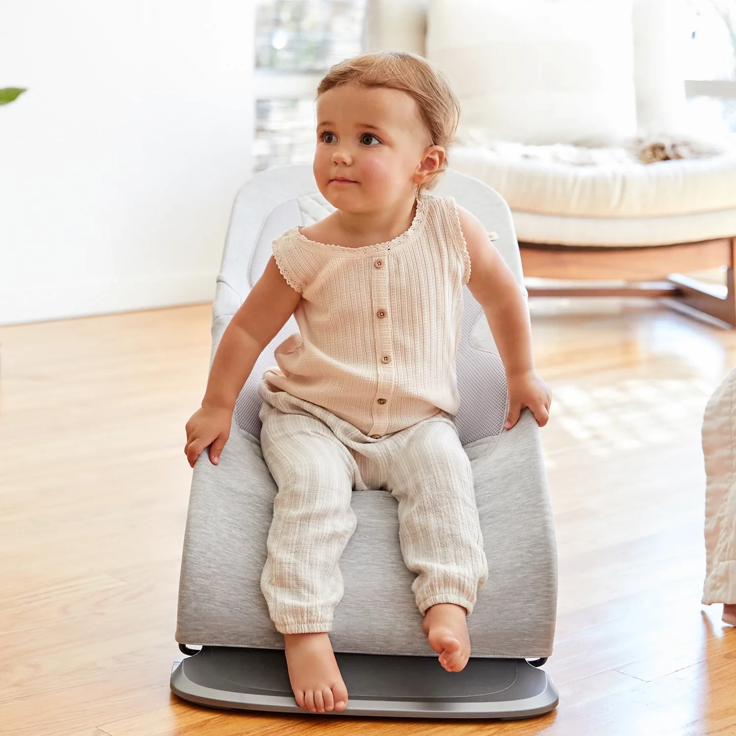The ergobaby evolve bouncer shown with a toddler sitting in it