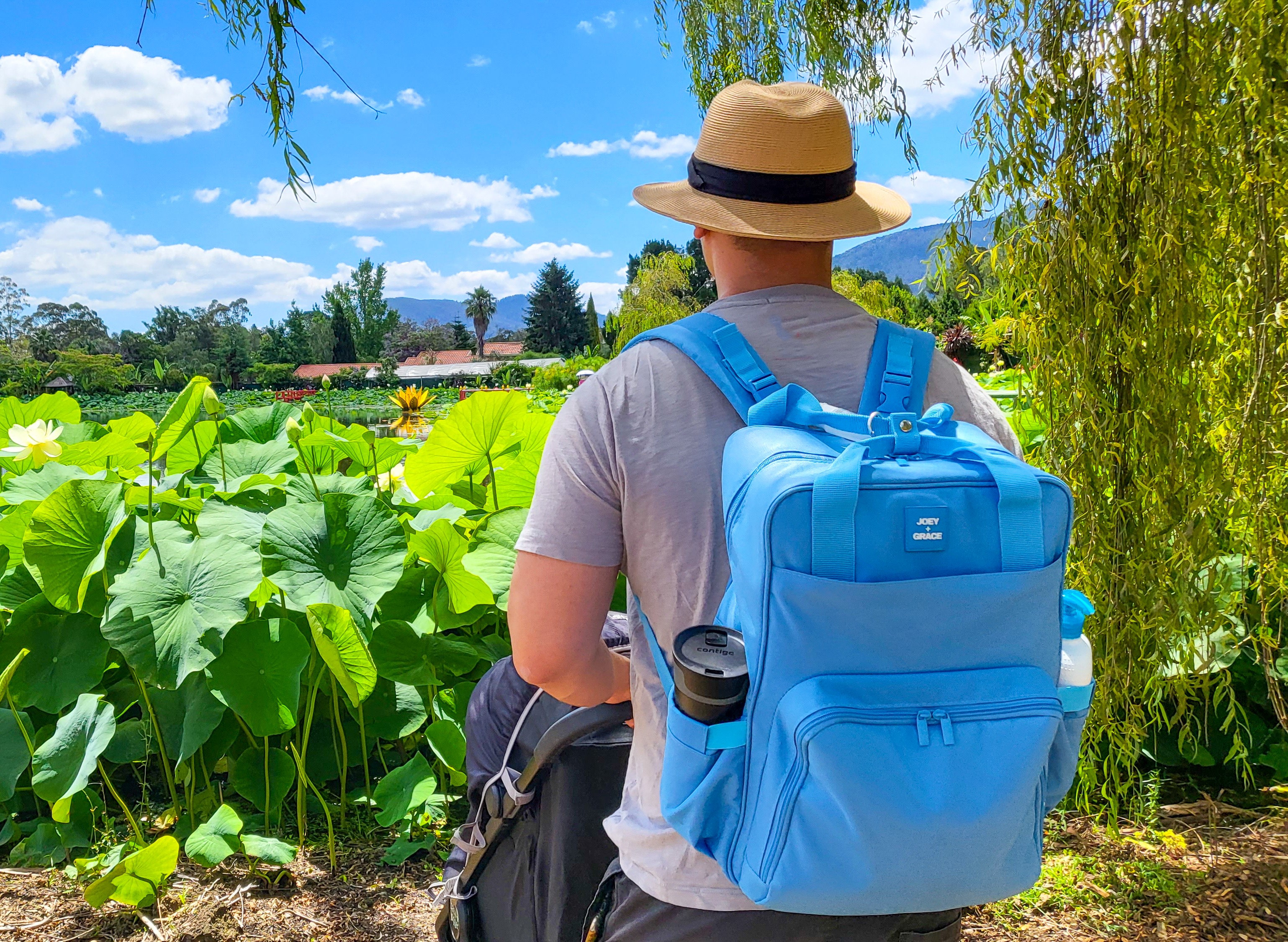 Joey and Grace The Camy colourful best nappy backpack worn by a dad – proving parenting essentials can be fun and stylish.