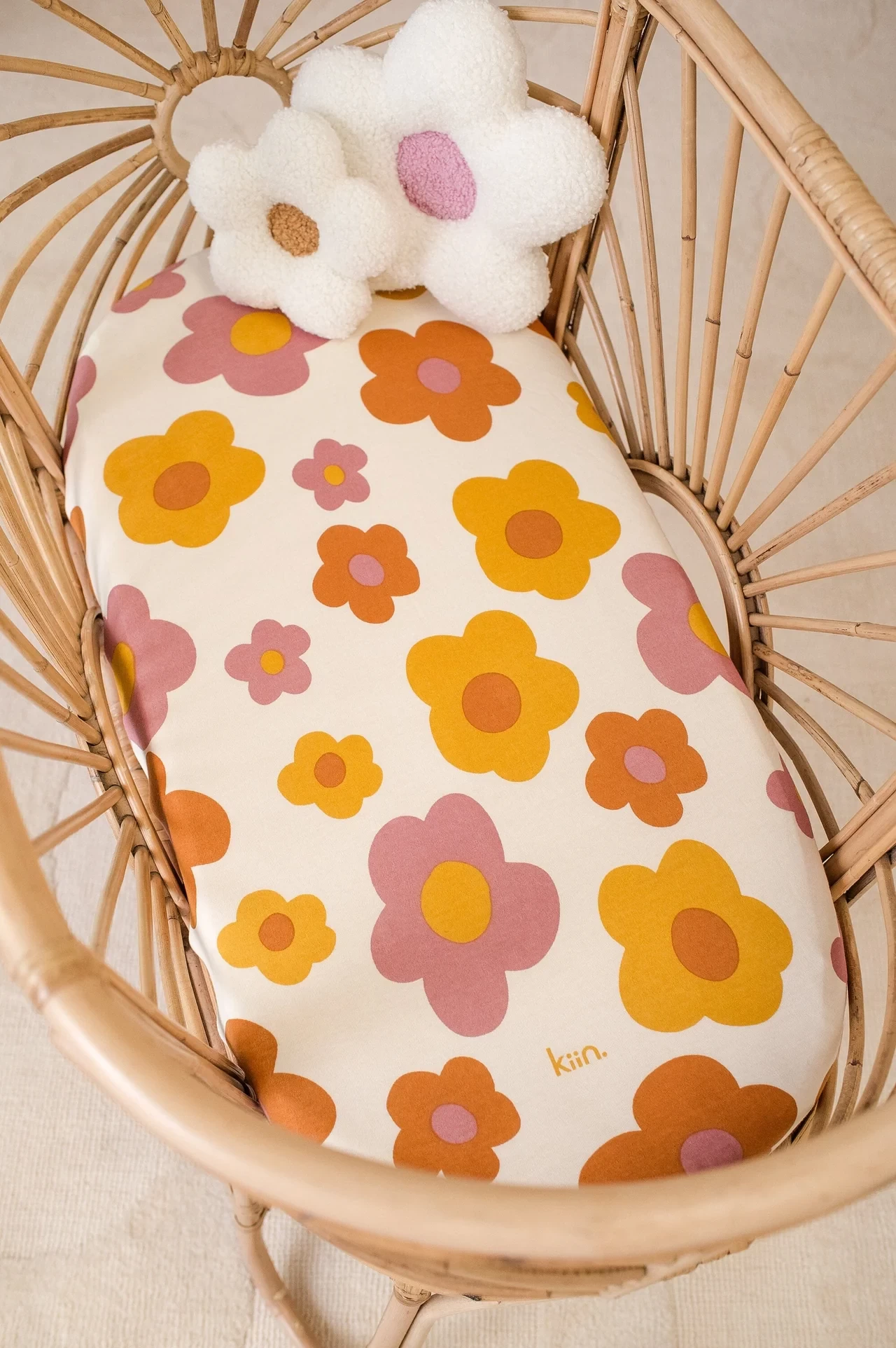 A floral bassinet sheet by Kiin