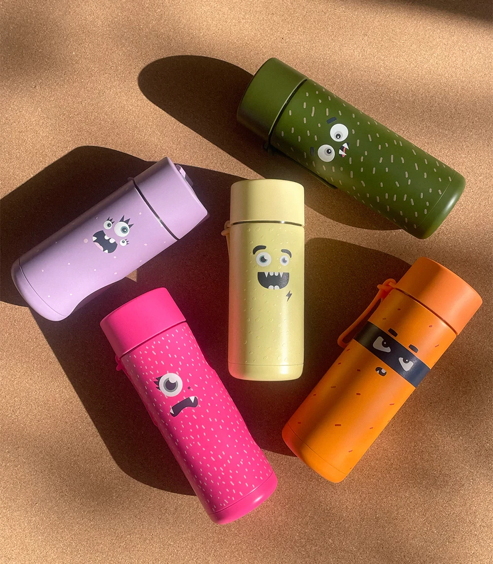 frank green franksters water bottles lying on the ground, showing all the colour options