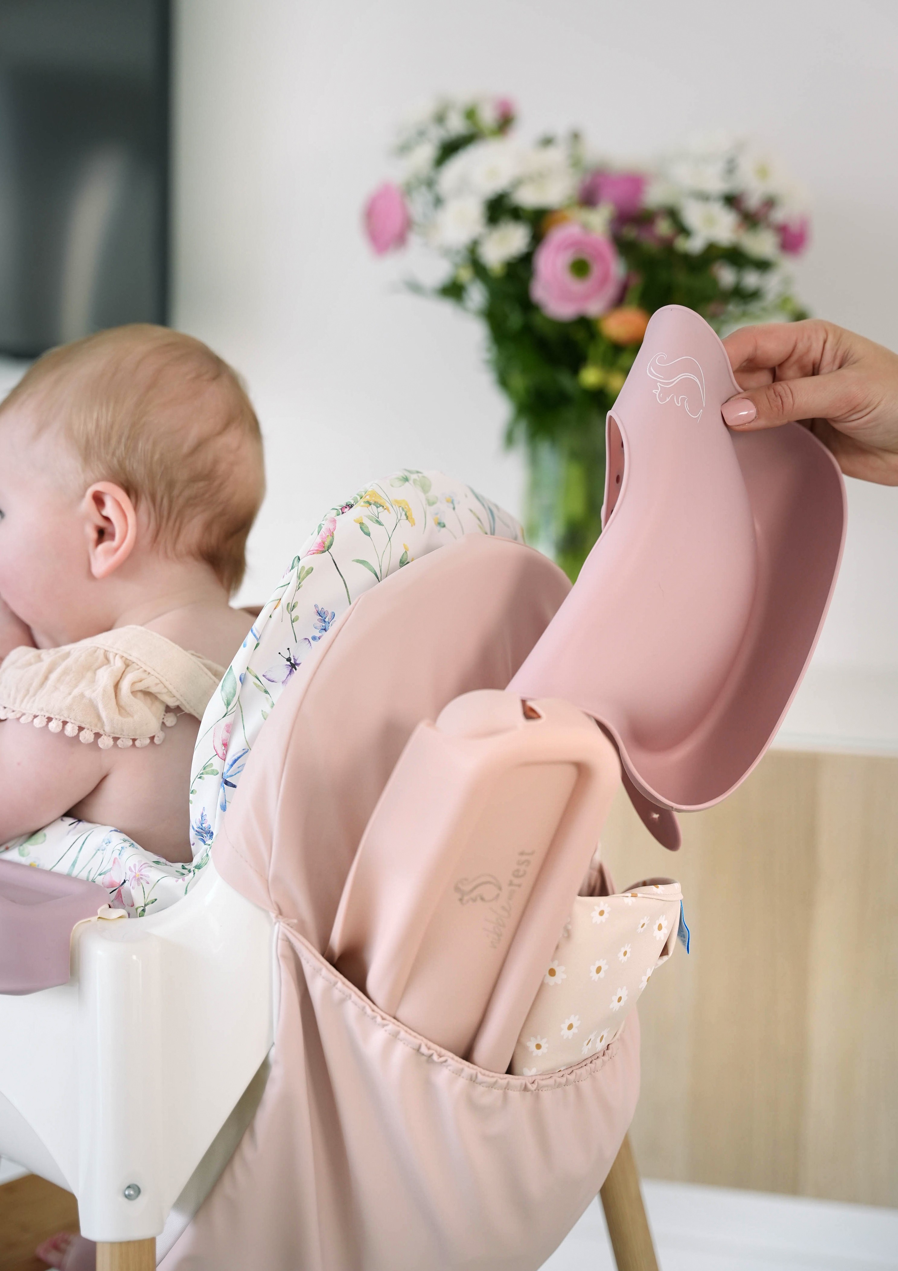 Safe and comfortable toddler seated on the Nibble and Rest High Chair for family mealtime