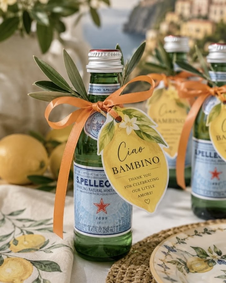 a bottle of mineral water with "ciao bambino" label on it at a baby shower
