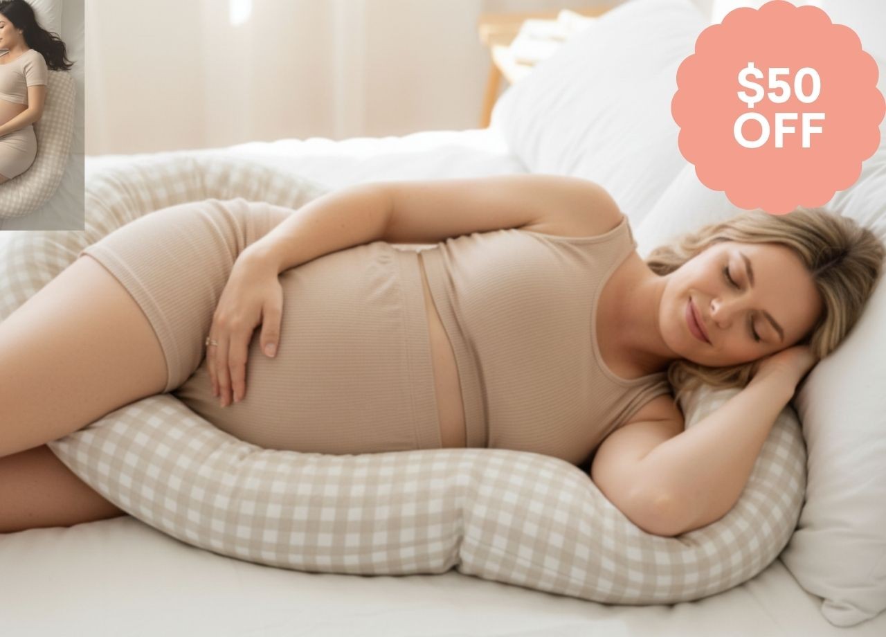 a pregnant woman lying on a pregnancy pillow, which is $50 off this EOFY 2026