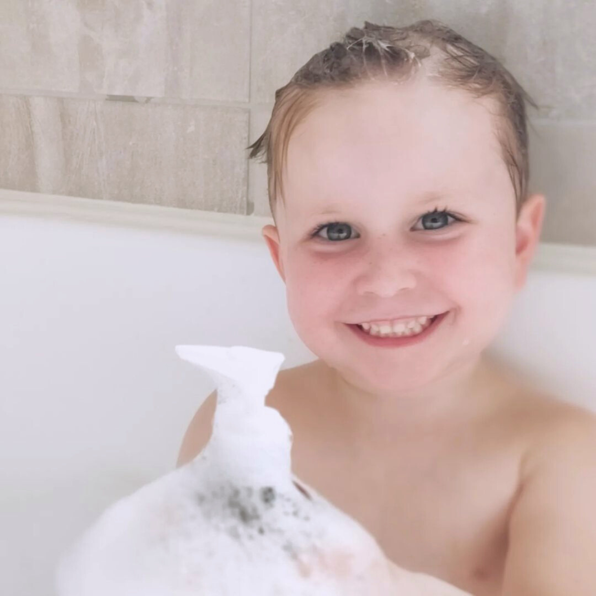 Baby taking a bath with Itchy Baby Co Baby Shampoo and Baby Wash for sensitive skin