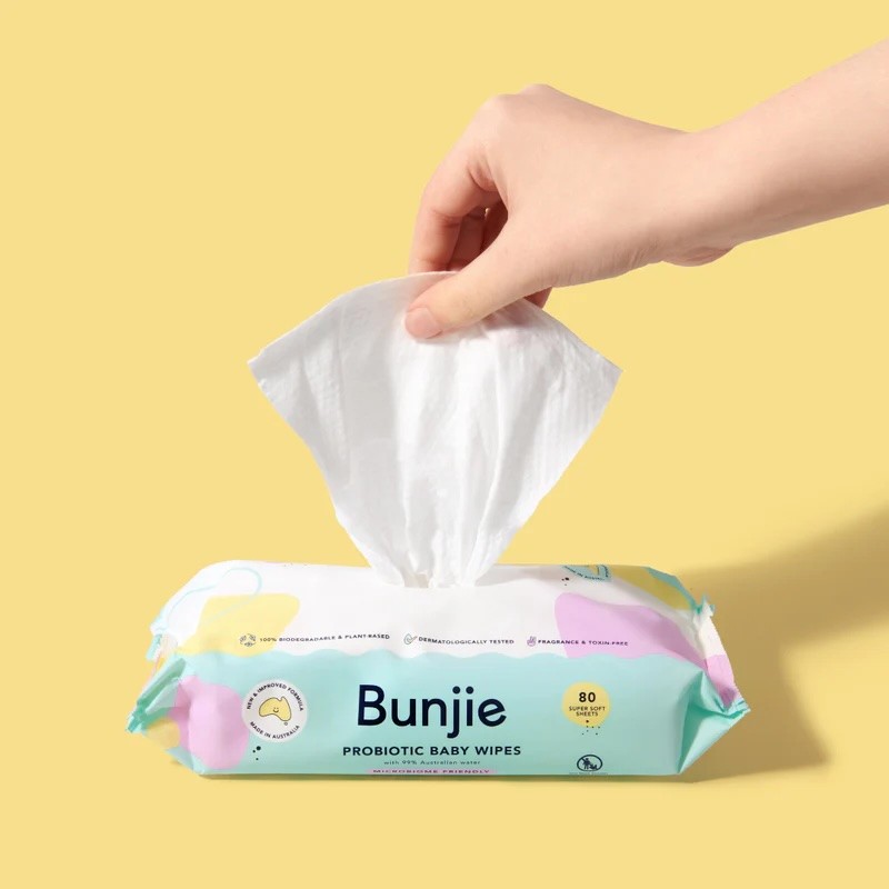 A packet of bunjie baby wipes against a yellow background