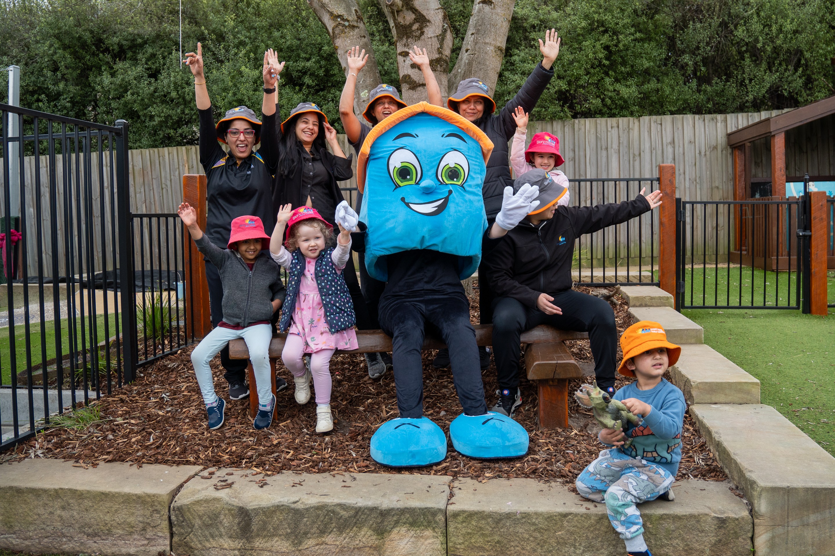 Educator with mascot and kids enjoying fun at the best childcare service.