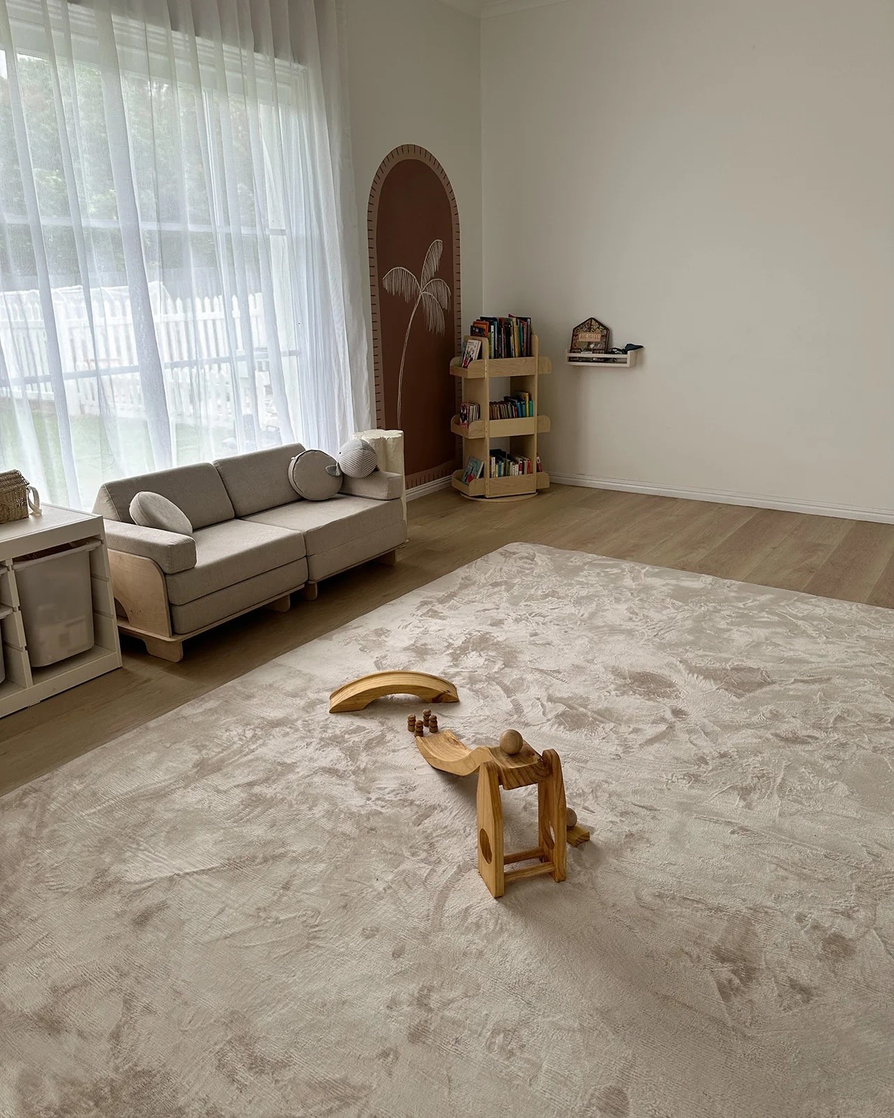 The Miss Amara Una baby play mat shown in a minimalist lounge room