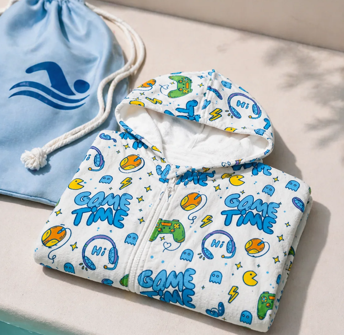 The Navi Baby hooded beach towel for kids in a game print