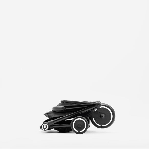 Folded smarTrike Traveler Stroller, showcasing its compact size and lightweight frame for easy transport