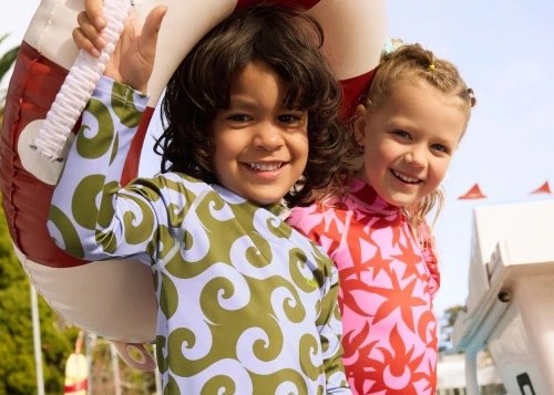 two kids in swimwear by bonds australia