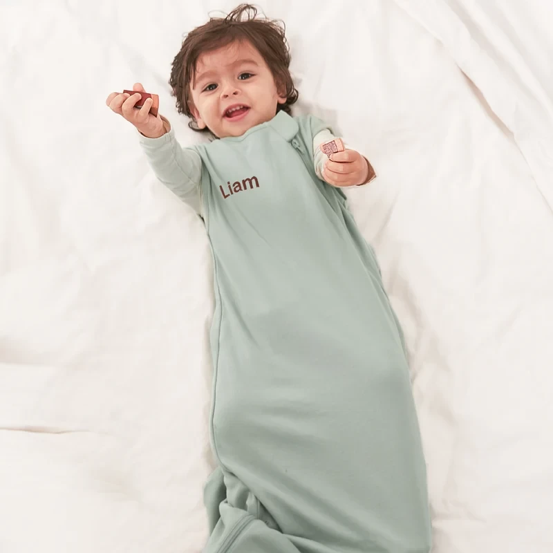 A baby in a sleeveless summer sleeping bag