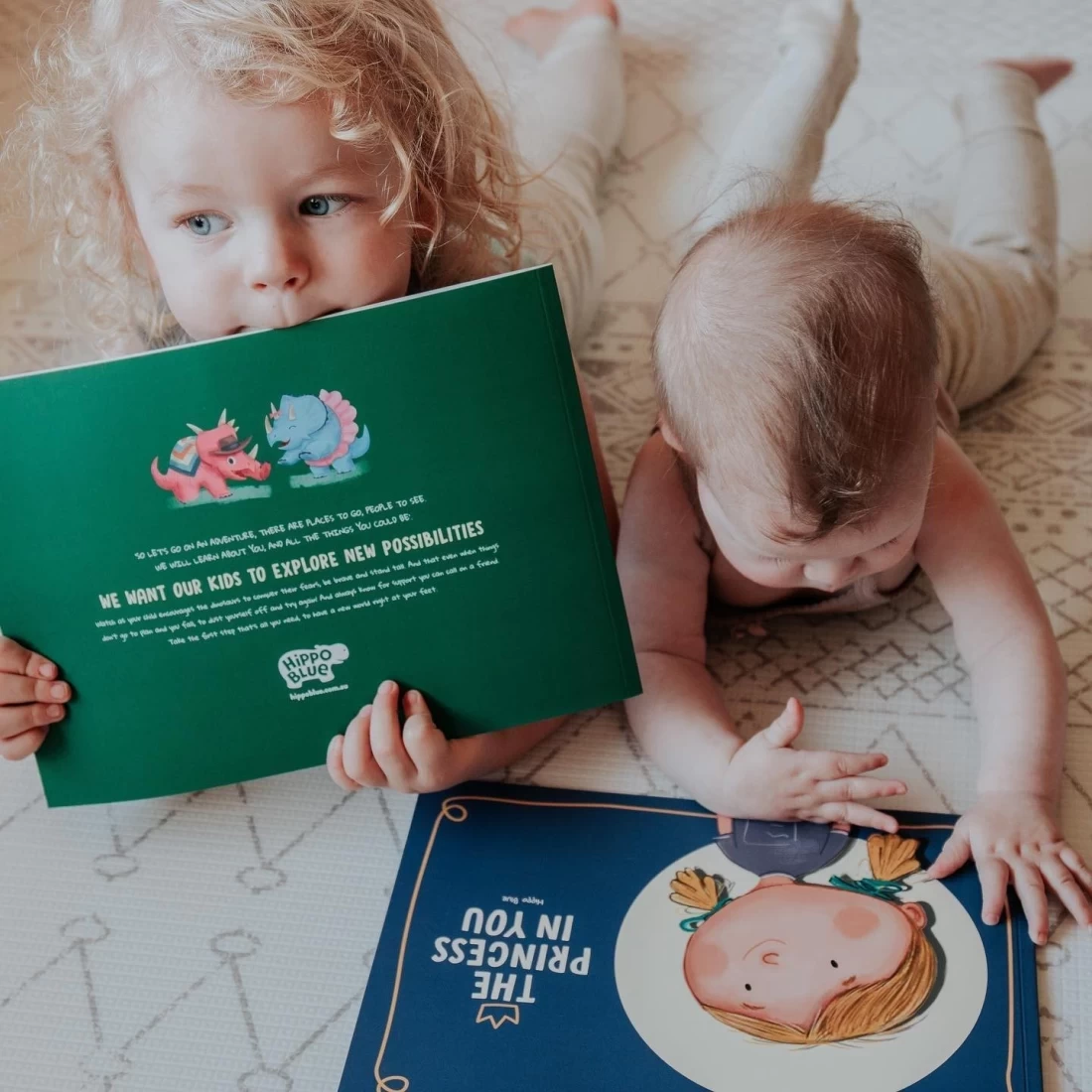Two kids reading Hippo Blue Story Books together, a personalised choice for the Best Christmas Presents for Kids
