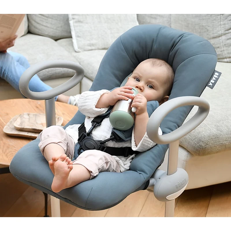 BeabaA baby in a bouncer holding the Beaba stainless steel sippy cup water bottle