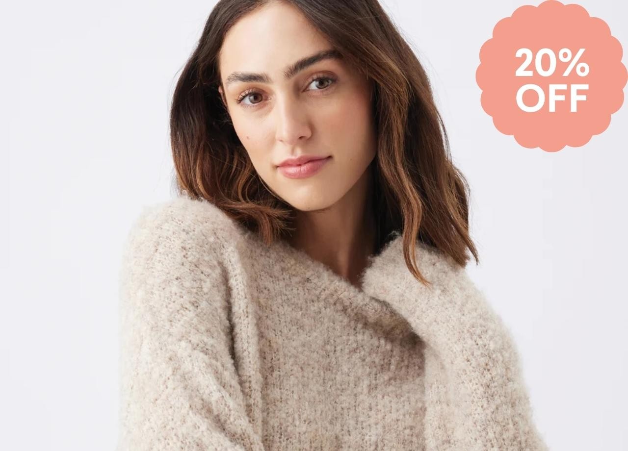 A pregnant woman in a fluffy jumper