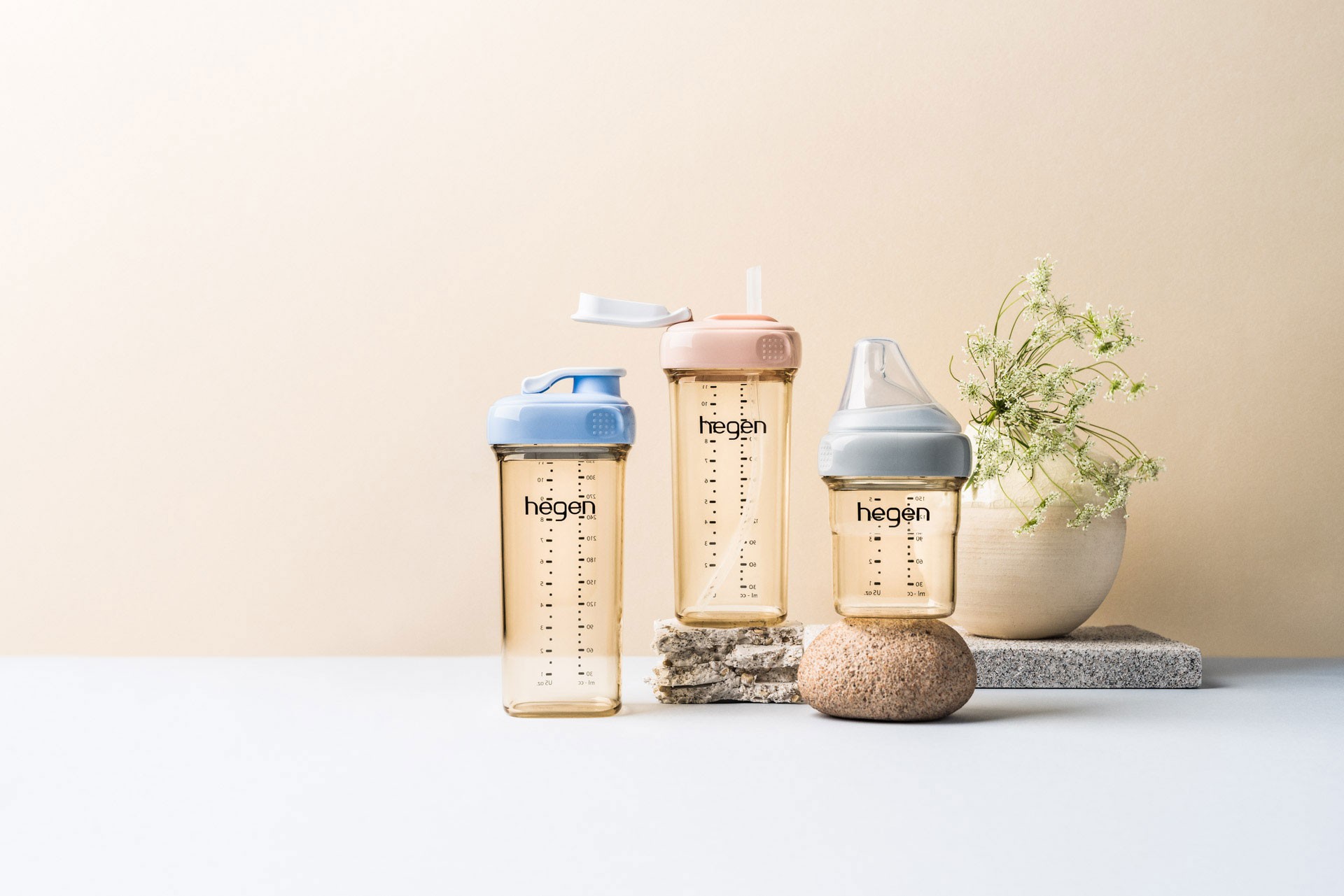 The best water bottles by Hegen in three different colours and lid types - straw, sippy, spout