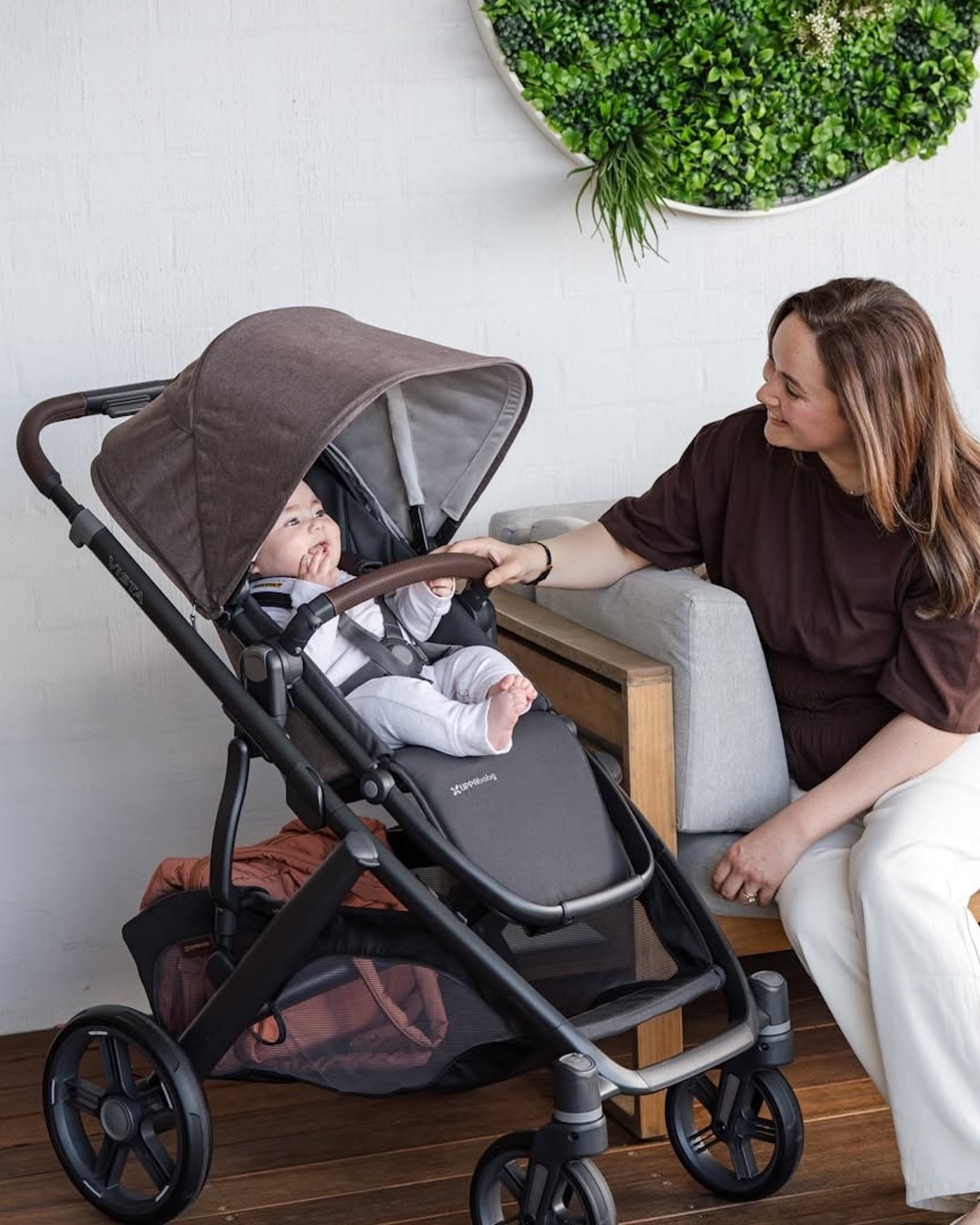 A mum talking to her baby who is in the Uppababy Vista V3 pram
