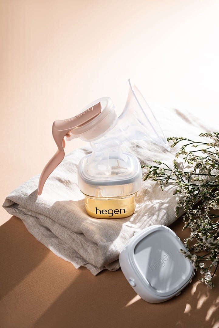 Hegen Manual Breast Pump Kit over a folded blanket