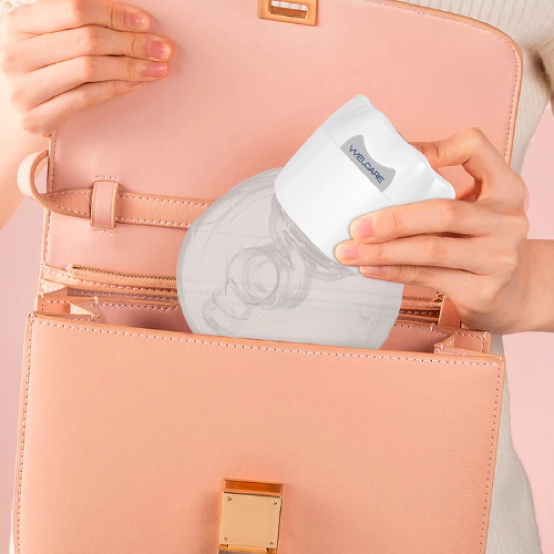 The Welcare Nurture Electric Breast Pump being packed into a peach bag
