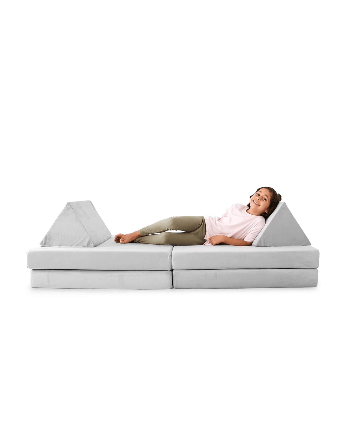 Kmart play couch with a child lying across it