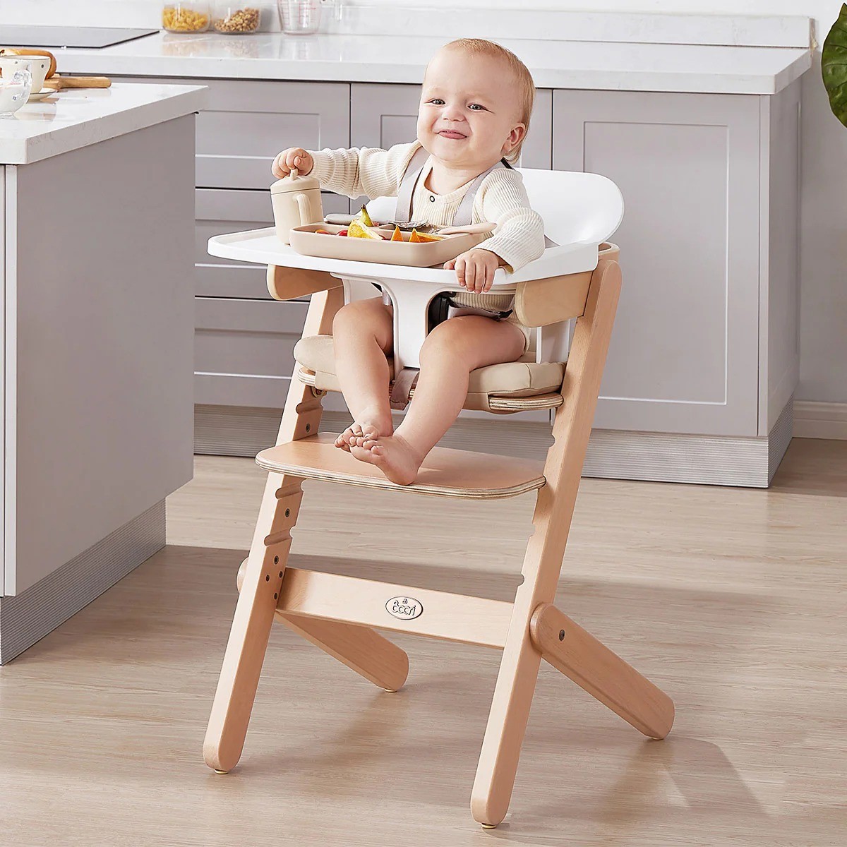 A baby laughing in the boori neat high chair