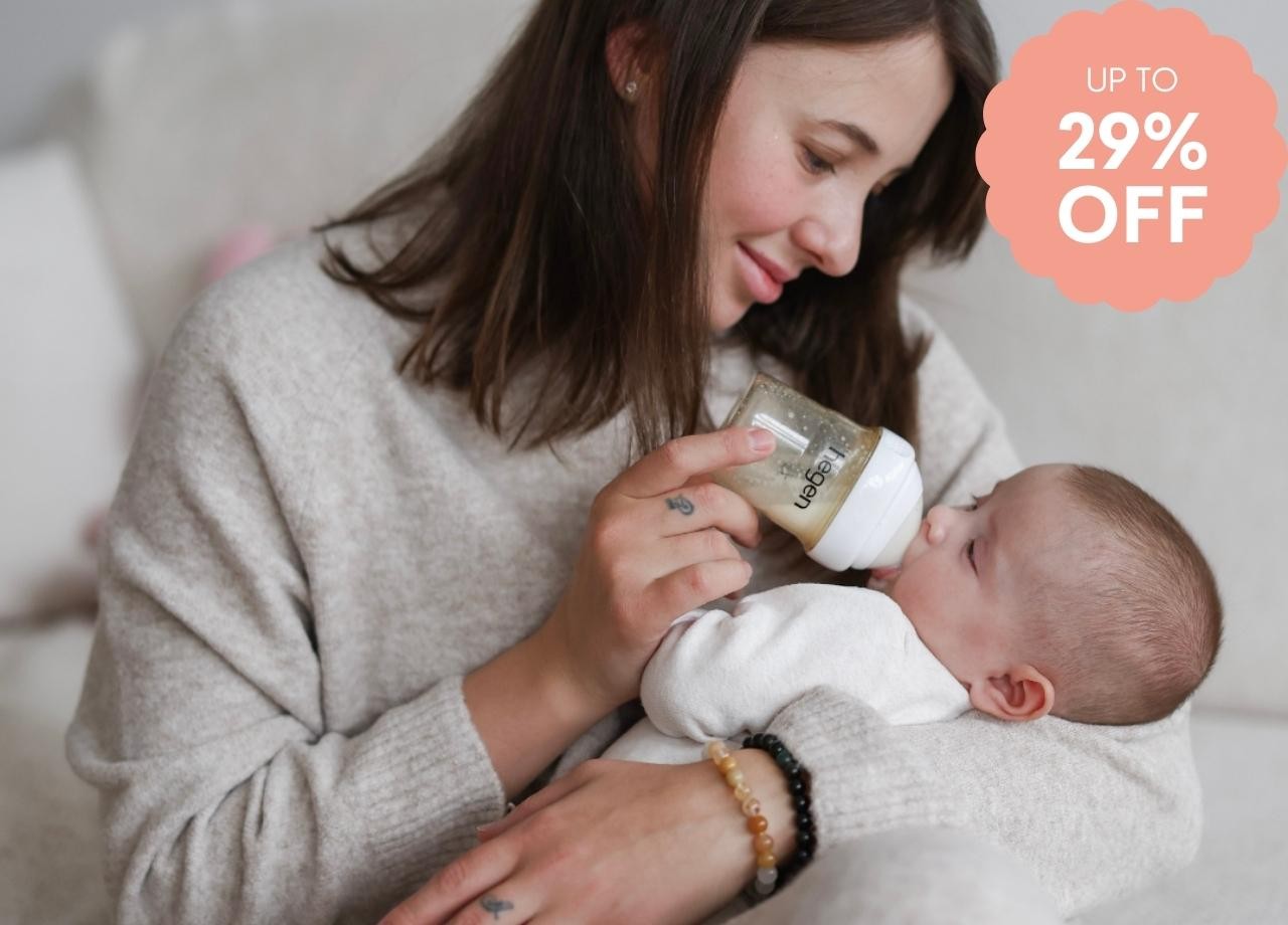 A Mum feeding her baby with a Hegen bottle