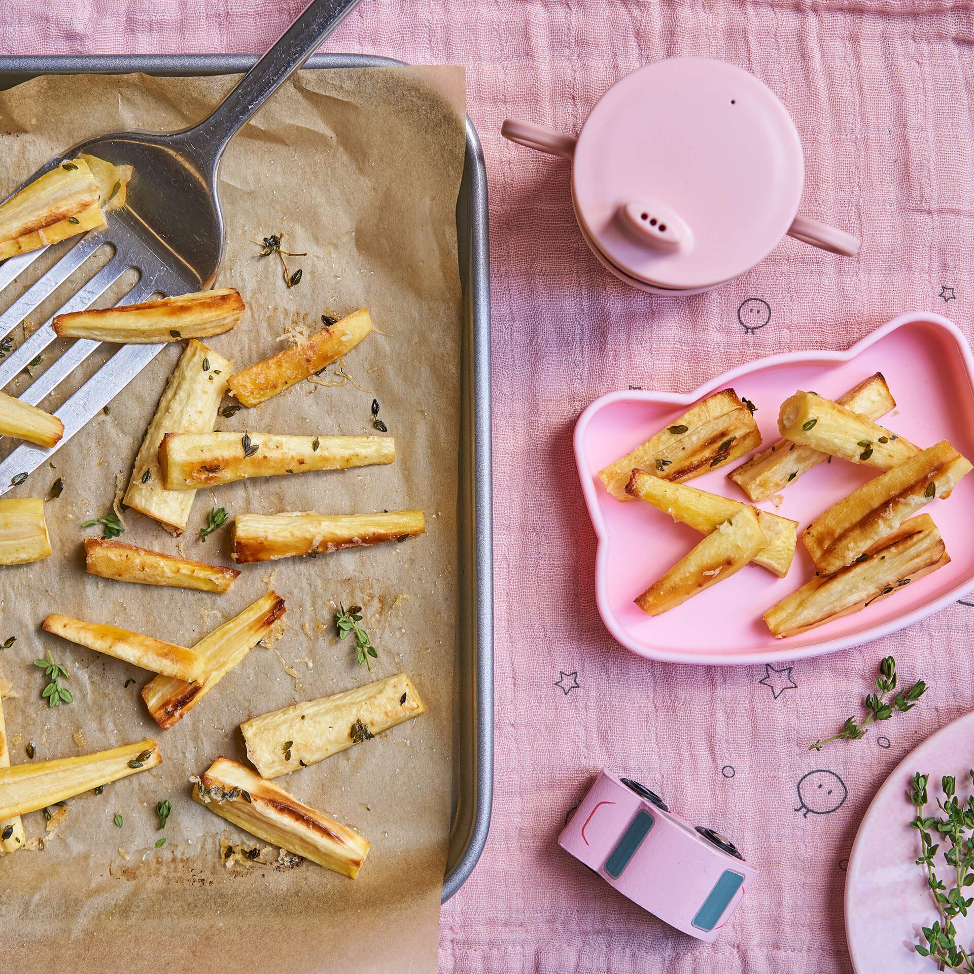 Baby mealtime set with baked potato wedges, a nutritious option for baby led weaning meals.