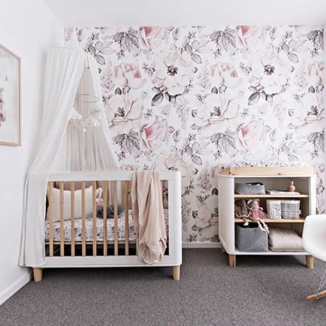 Elegant nursery with white cloth accents and a wooden and white crib, part of the Best Baby Girl Nursery Ideas.