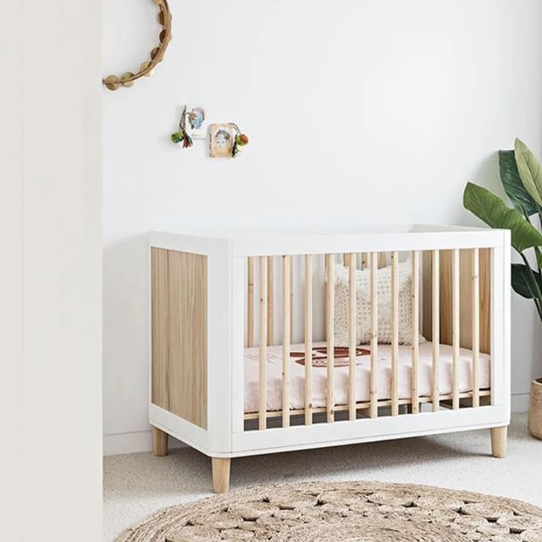 White minimalist nursery design showcasing the best baby girl nursery ideas for modern Australian homes