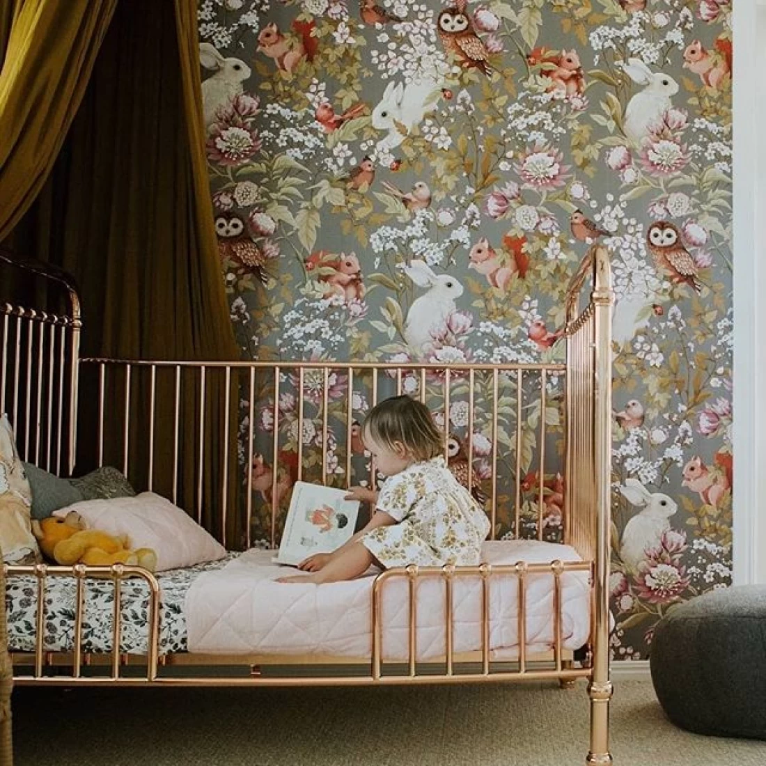 Best baby girl nursery ideas with a neutral tone design and baby on the crib for a soothing, modern look.