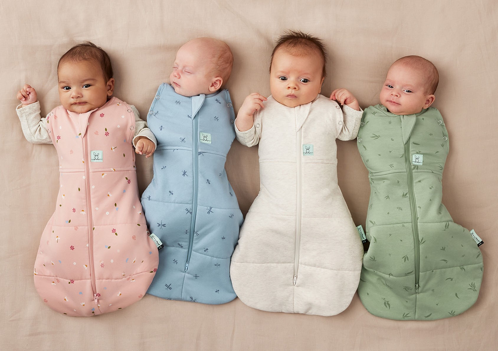 Newborns dressed in ErgoPouch baby sleeping bags and the best baby swaddles for safe sleep