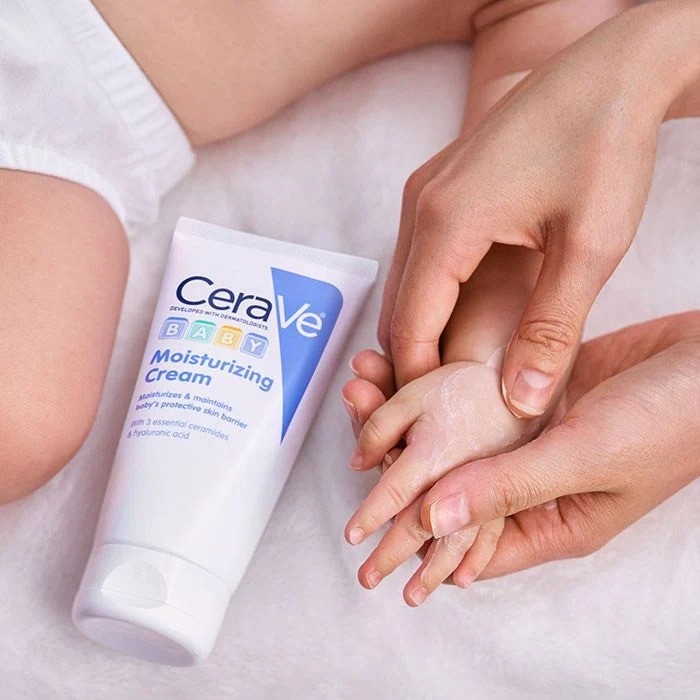 cerave baby moisturiser being applied to a baby's hand