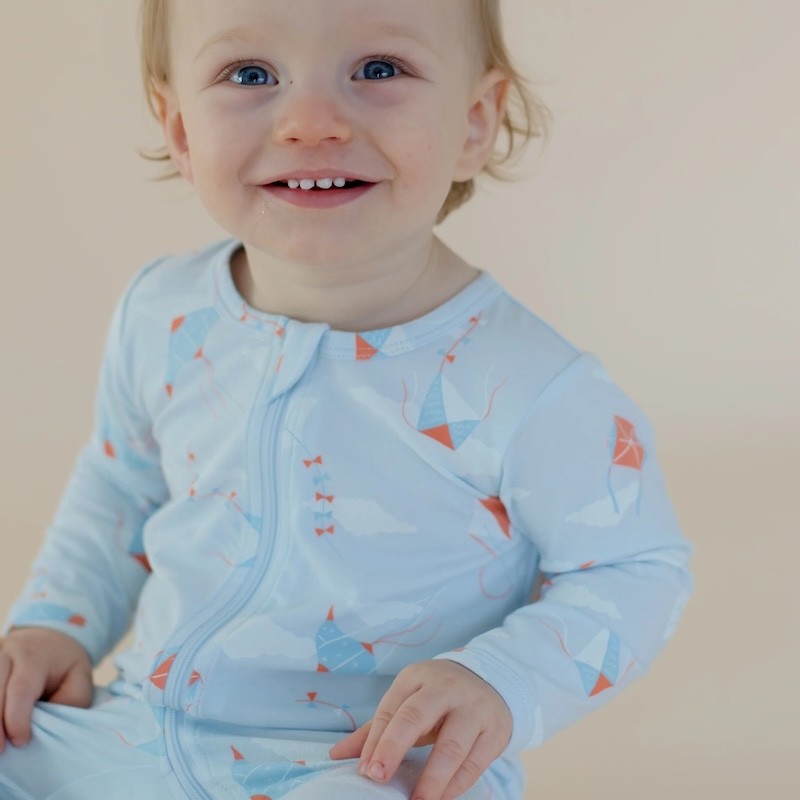 A baby in a marquise blue growsuit