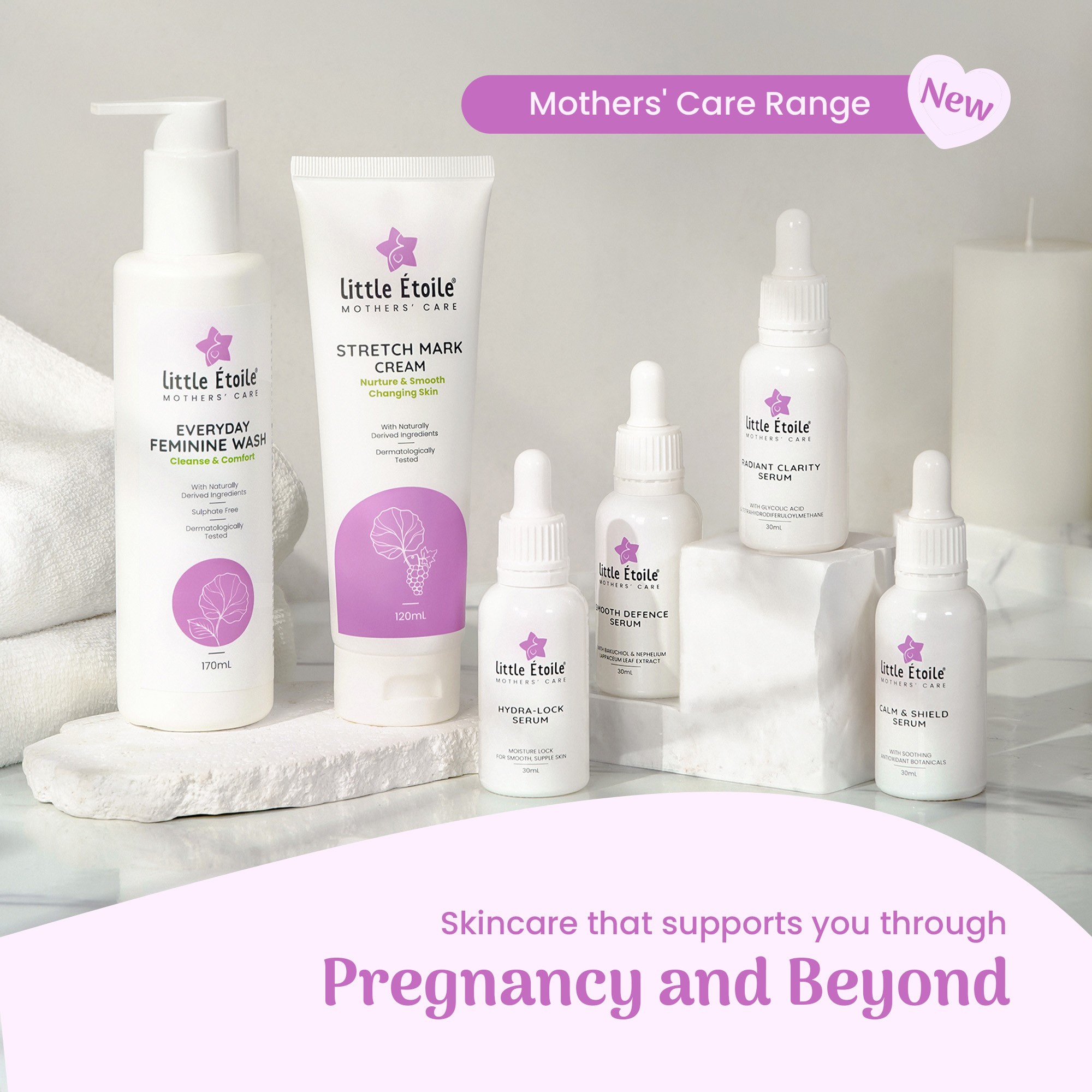 Six Little Étoile skincare bottles lined up on a table with candles and bath towel – best skincare for pregnancy and beyond.