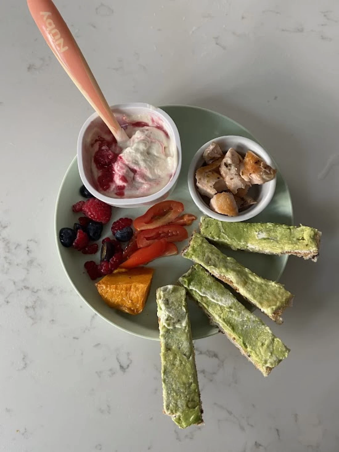 Top view of healthy baby foods, part of a guide for introducing solids to baby.