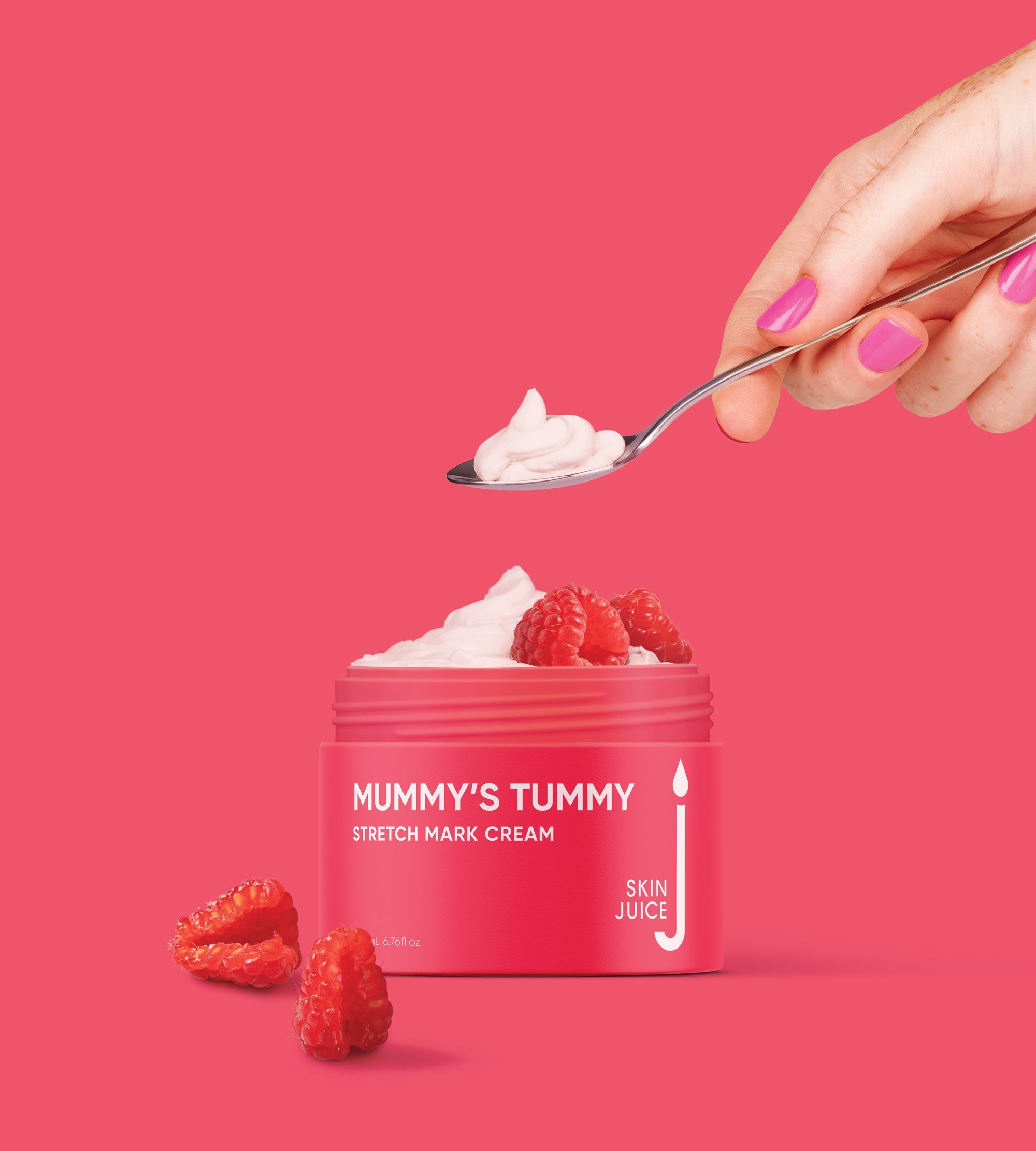 Hand scooping Skin Juice Mummy’s Tummy Cream with spoon, nourishing care for pregnancy skin condition.