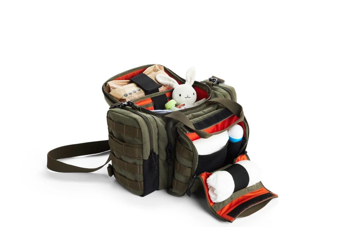 Modern bag with neatly arranged baby items on a white background, perfect as the Best Father’s Day Gift