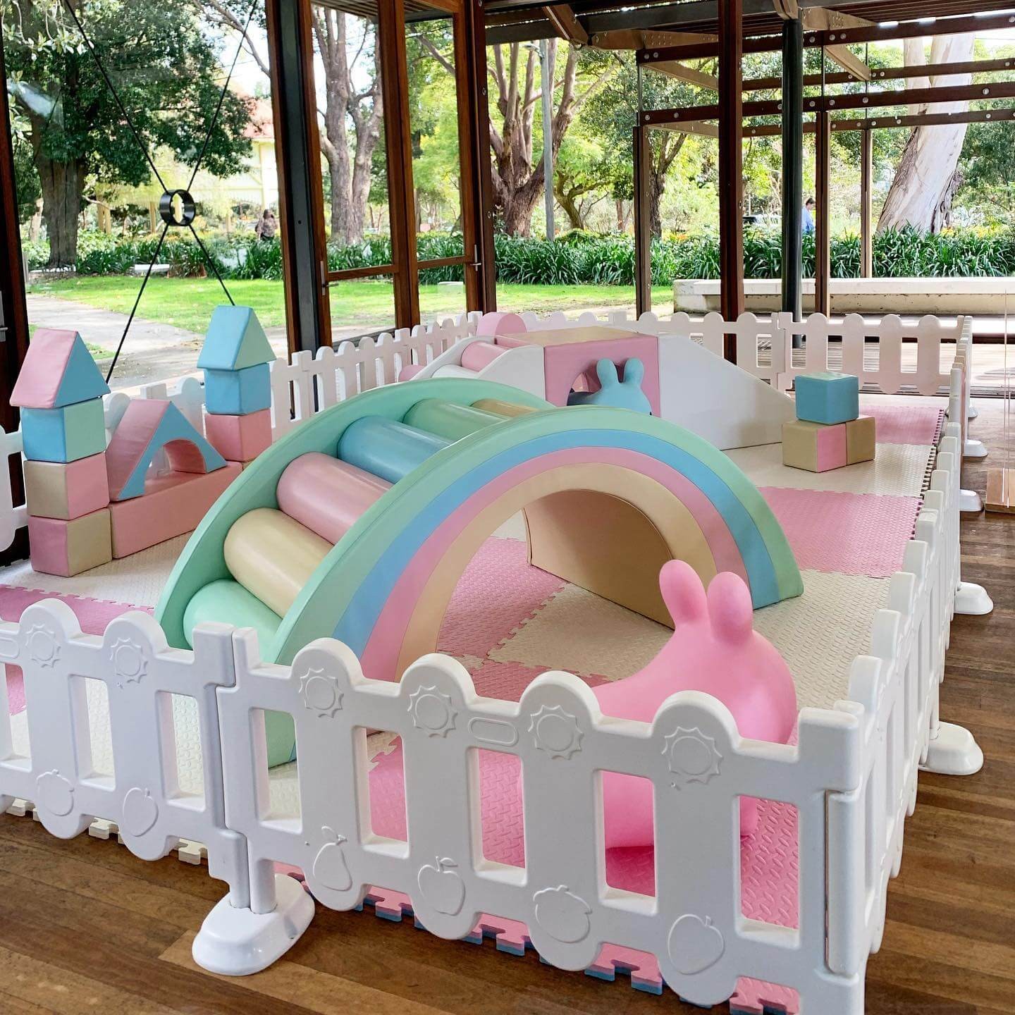 Unicorn colour theme party setup with climbing toy perfect for the best kids party ideas