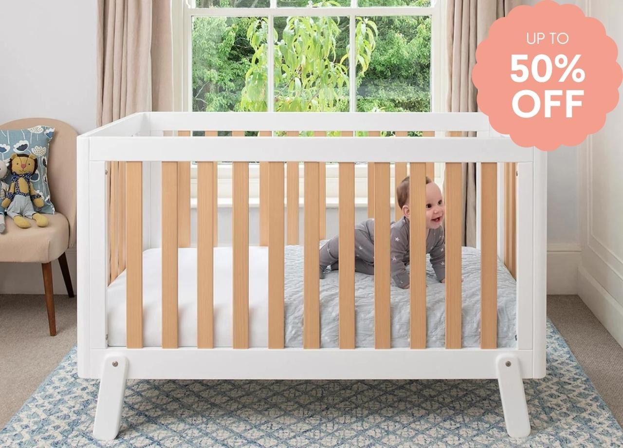 Boori cot with a baby in it