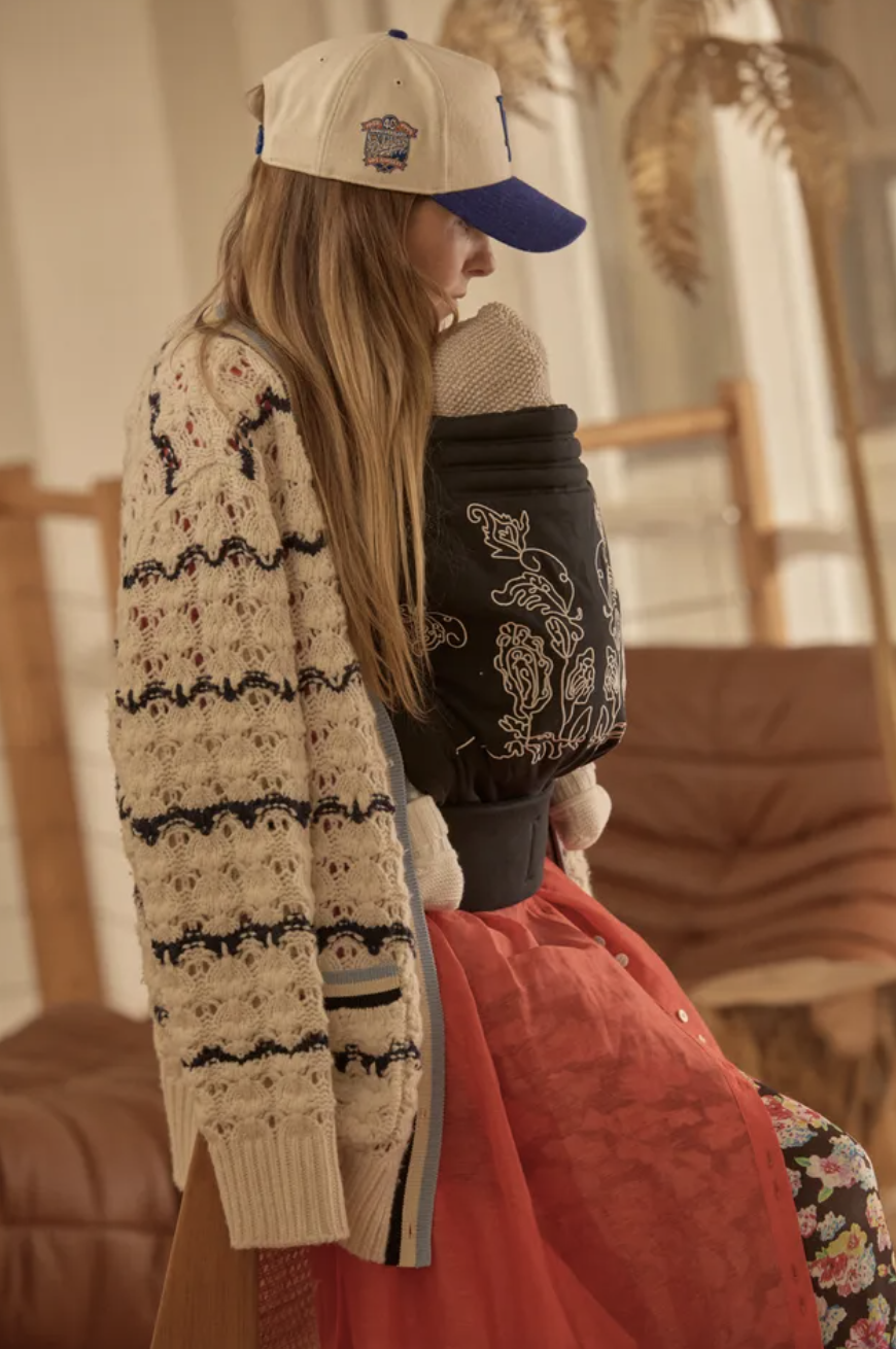 Side view of a mum wearing The Tote Studio, the best baby carrier for all-day comfort.
