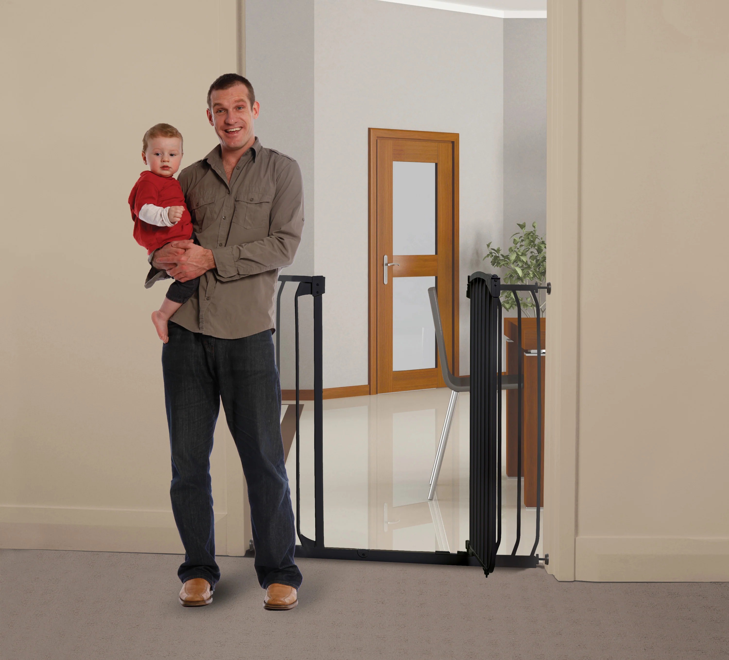 the tall chelsea baby gate shown with a dad next to it for height example