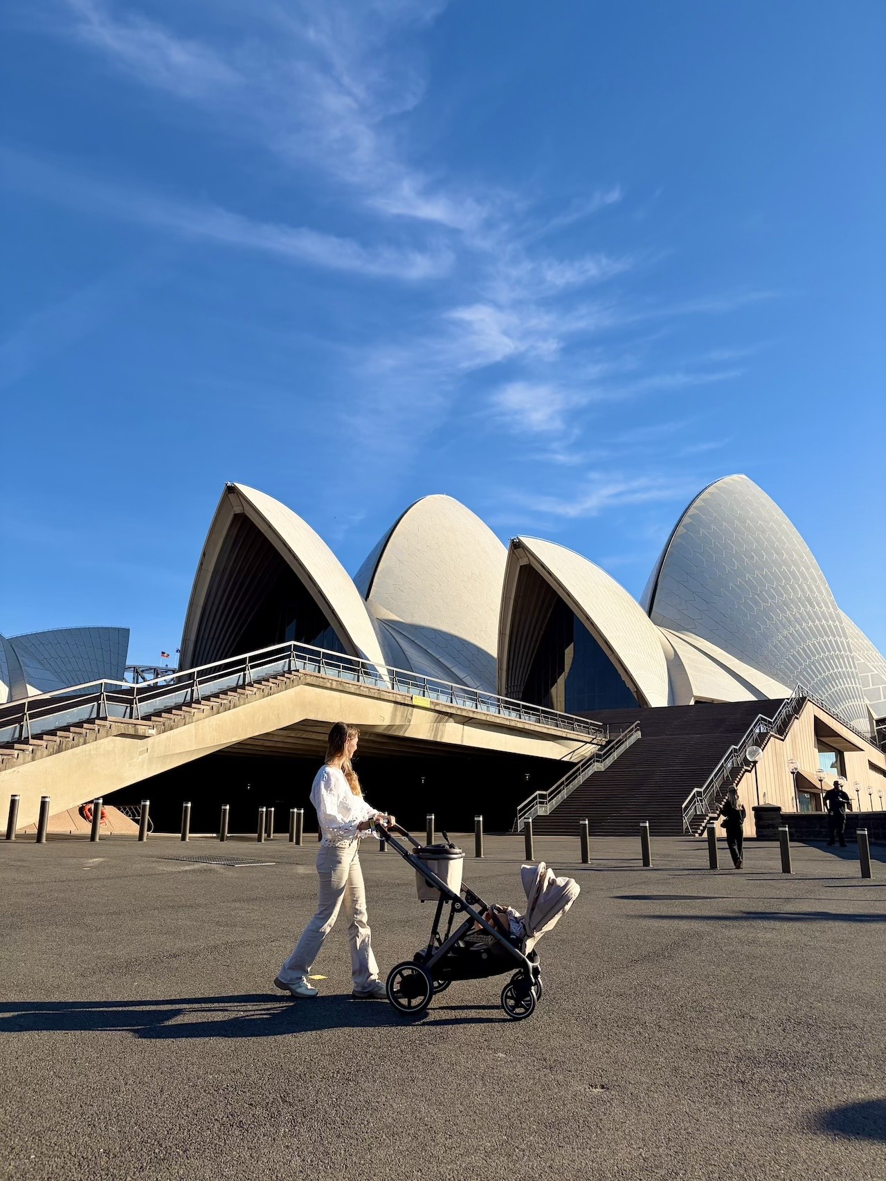 An Australian mum pushing the Cybex double pram in front of the Sydney Opera House
