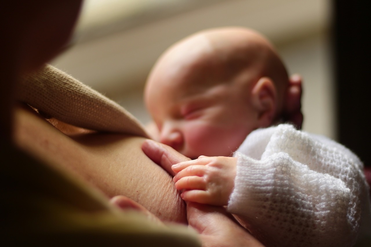a newborn feeding at night