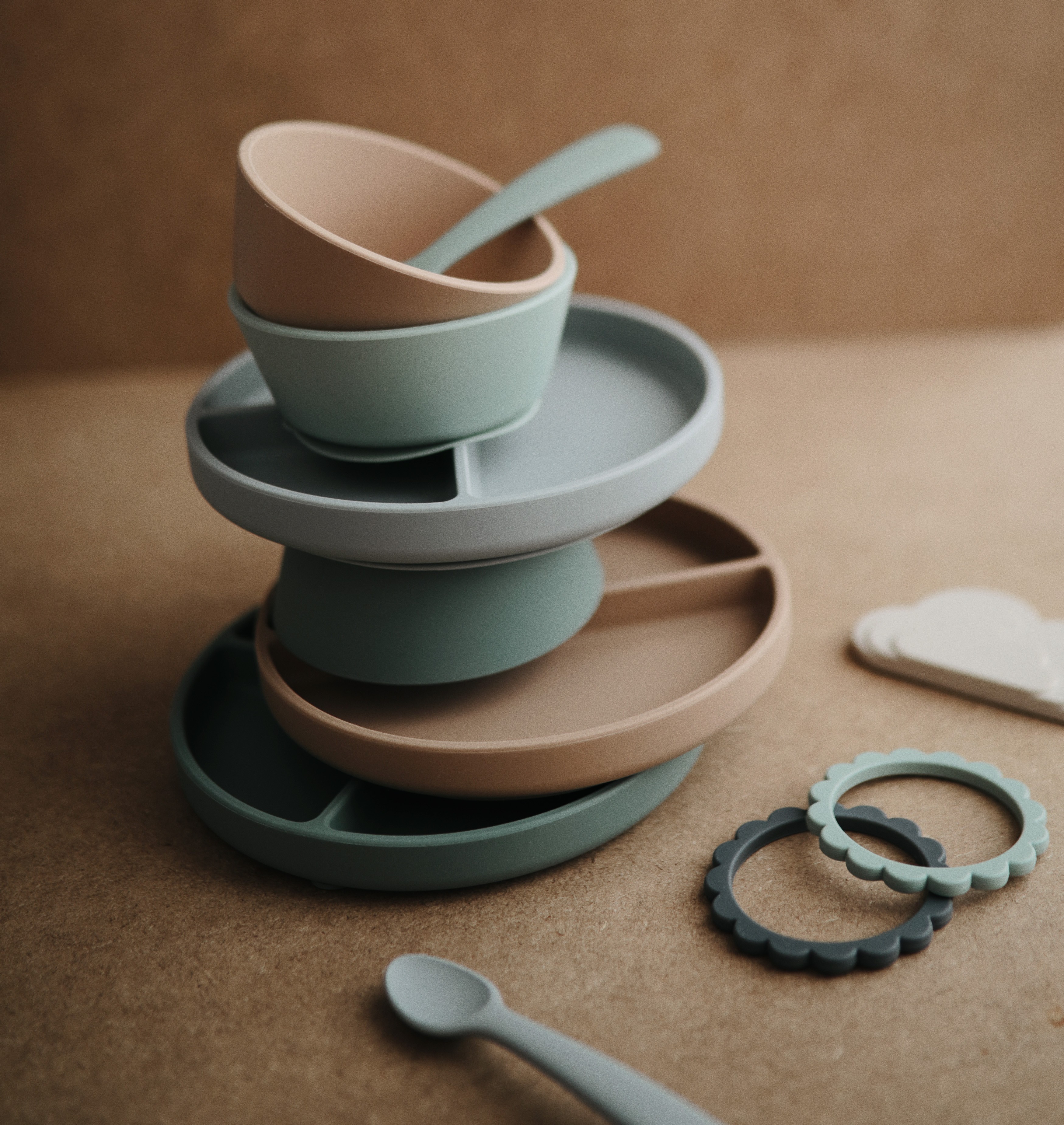 rganised Mushie Silicone Dining Set piled neatly, showcasing the Best Feeding Essential for babies and toddlers.
