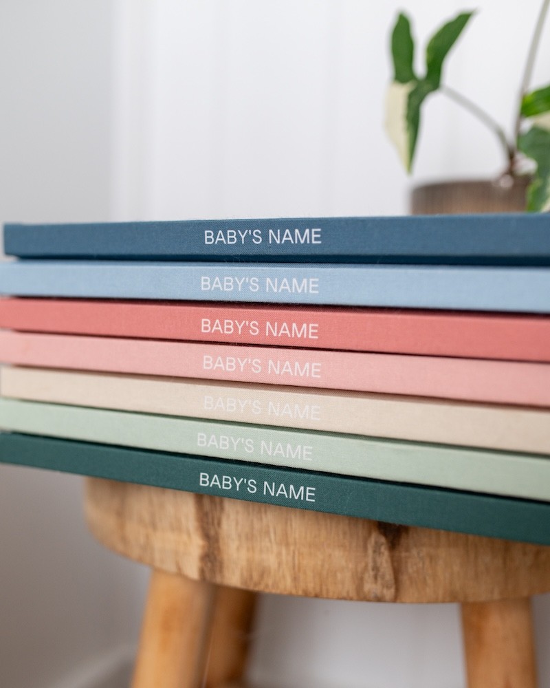 a stack of the memorised baby books