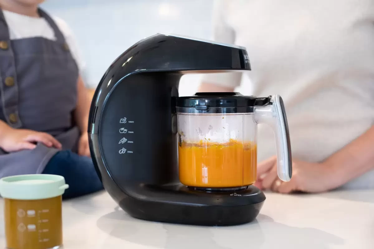 A baby food maker with pumpkin in it