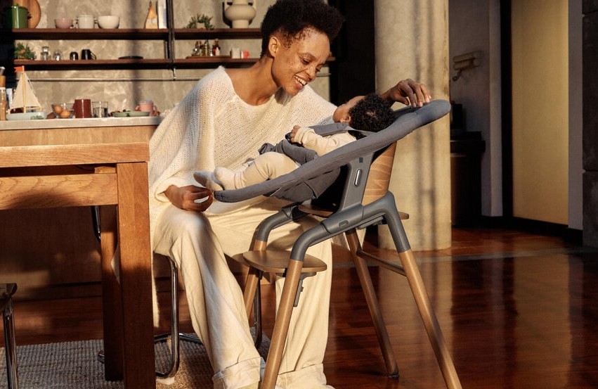 Bugaboo high chair being used by a mum with her newborn